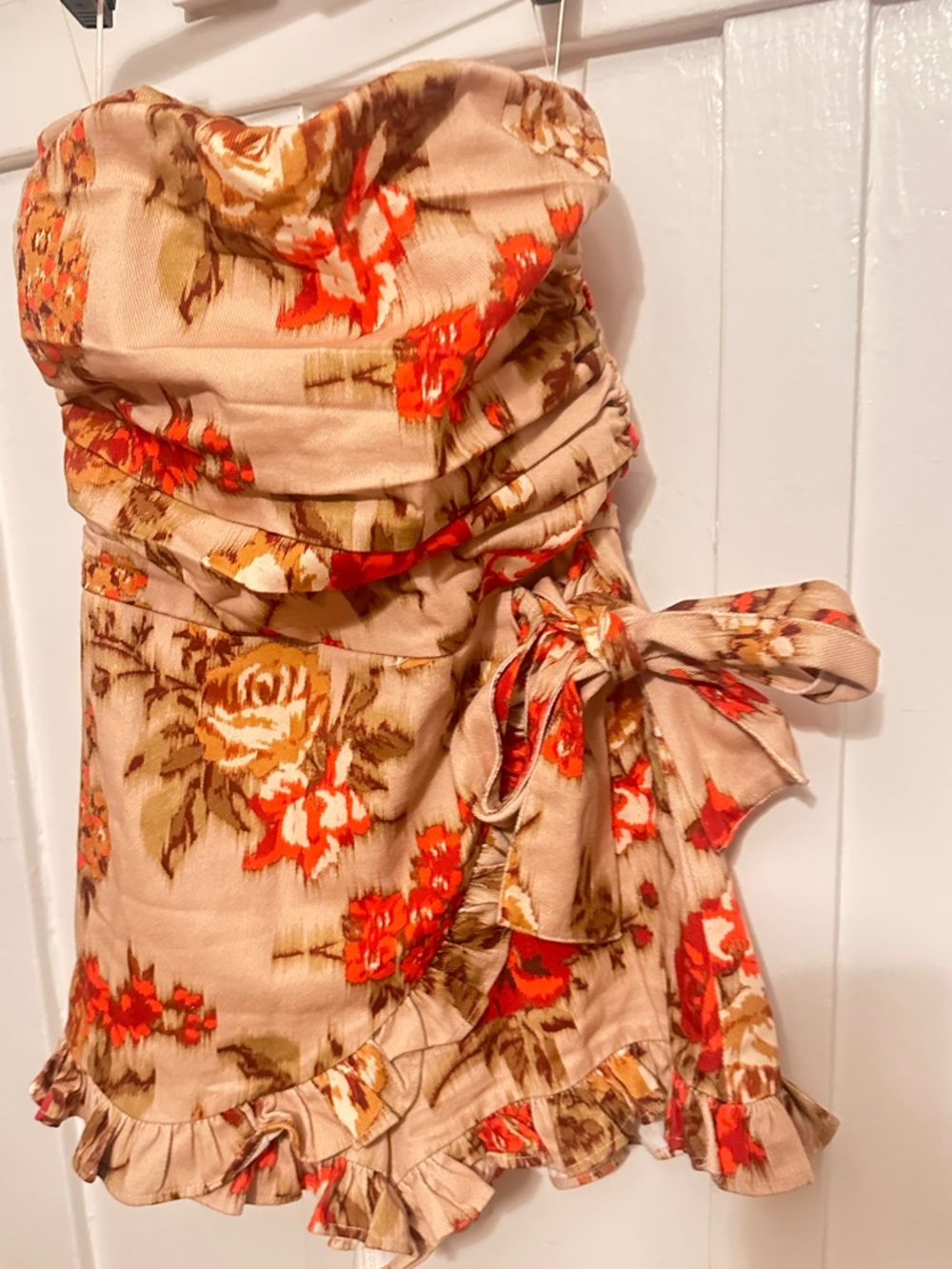Olivaceous Strapless Floral Tie-Waist Romper in Beige and Orange